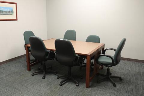 picture of room A with a table and 6 chairs. 